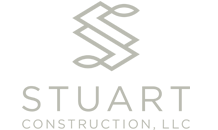 Logo for Stuart Construction, LLC. Features a stylized geometric S with leaf-like shapes on each end, above the company name in modern, uppercase font. Background is light gray—perfect to invest in Baldwin Alliance projects.